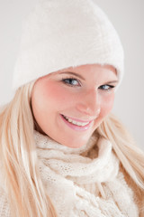 Young funny sexy winter woman in hat and scarf