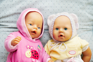 Dolls kids in multi-coloured clothes