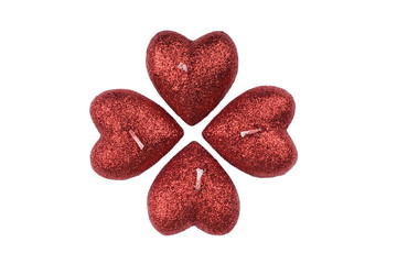 Decorative  candles in  form of heart represent clover(cross)