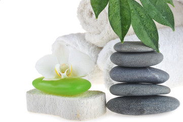 Obraz na płótnie Canvas green soap, stones and fresh leaves