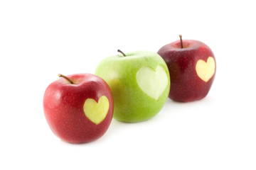 apples with a heart isolated on white