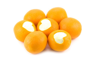 Oranges with a heart isolated on white