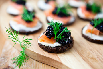 Canapes with smoked salmon and caviar
