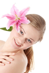 Beautiful blond woman with lily flower