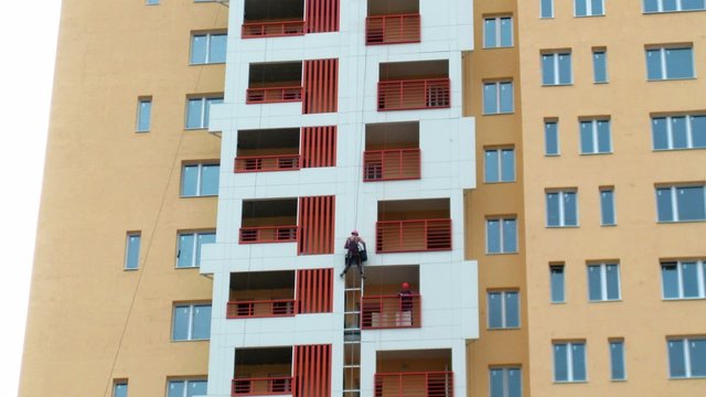 House building: installation of glasses on balconies