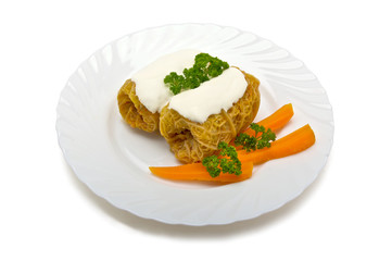Meat stuffed cabbage leaves sour cream isolated on white