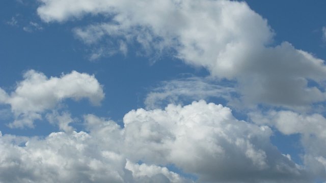 Clouds float on blue sky