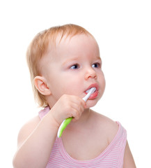 little girl brushing her teeth