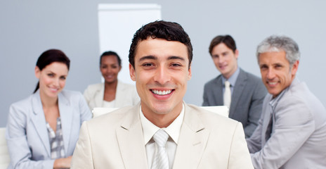 Smiling businessman leading his team in a meeting