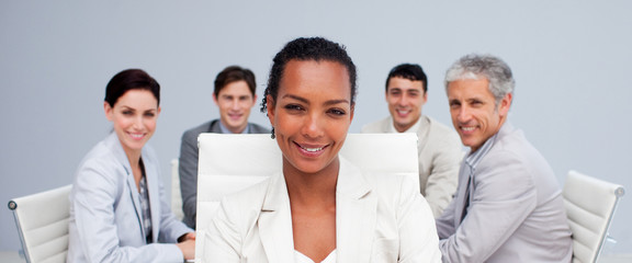 Fototapeta na wymiar Afro-American businesswoman smiling in a meeting