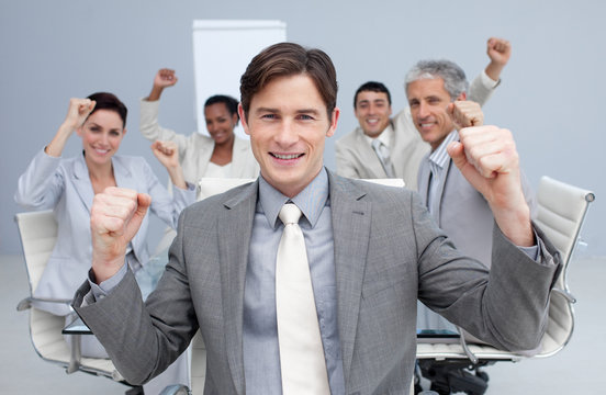 Happy Business Team Celebrating A Sucess With Hands Up