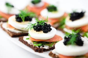 Fotobehang Canapes with smoked salmon and caviar © B.G. Photography