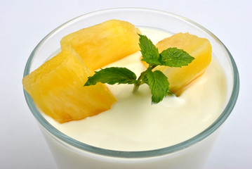 some organic summer fruit in yogurt and mint