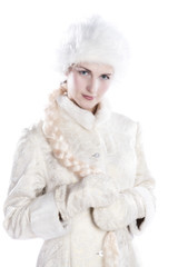Beautiful girl in a white winter coat