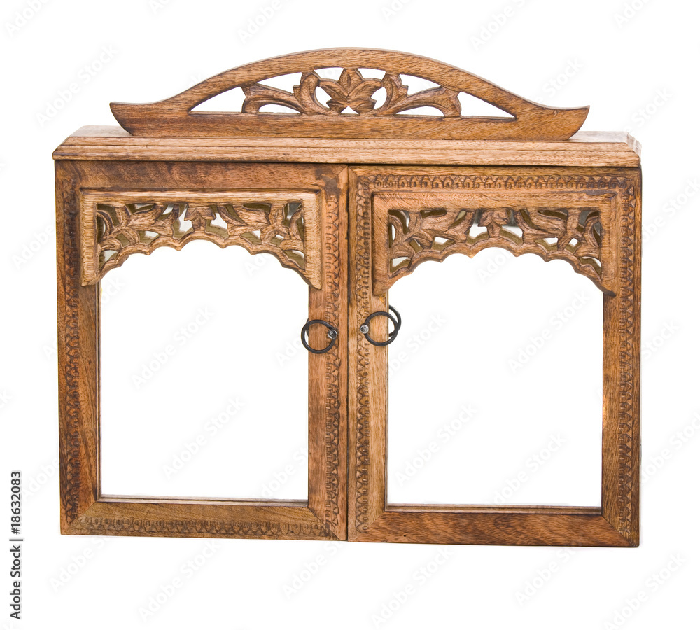 Wall mural carved wooden cabinet over white background