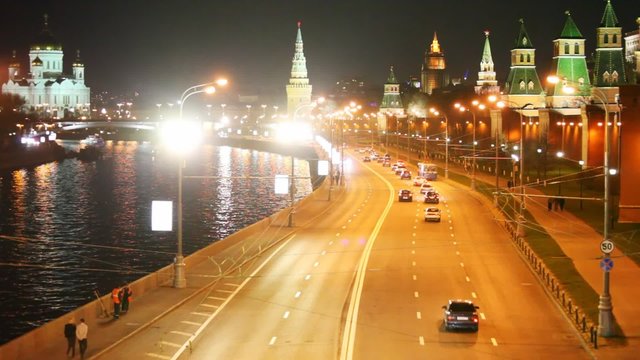 Cars, road, river, Kremlin walls and towers in Moscow city