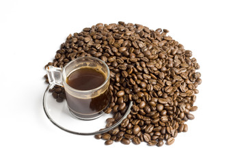 Glass cup of turkish coffee with coffee beans around