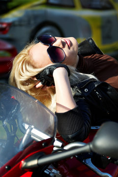 The blonde in points on a motorcycle