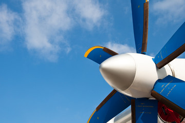 Blue propeller of white airplane