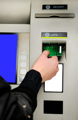 Inserting plastic card visa into ATM