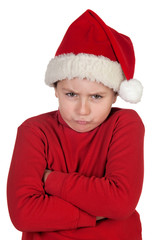 Frowning boy with santa hat