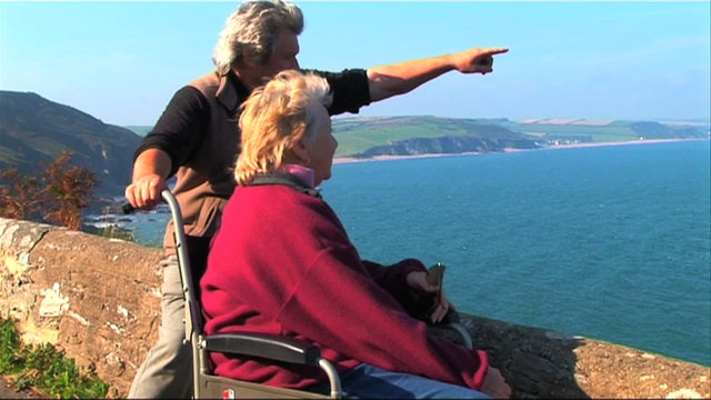 Disabled person in a wheel chair on an outing