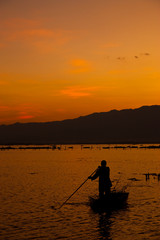 Fisherman in Payao lake, north of Thailand