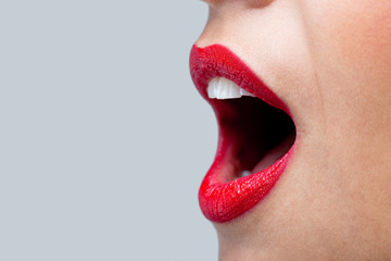 Womans mouth wide open with red lipstick. - 18649664