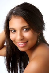 Obraz premium Beautiful young black girl with huge smile on white backdrop