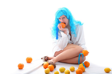 Fototapeta na wymiar blue hairs girl with oranges and lemons