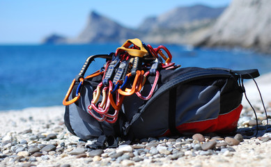 Backpack of the rock-climber with quickdraw