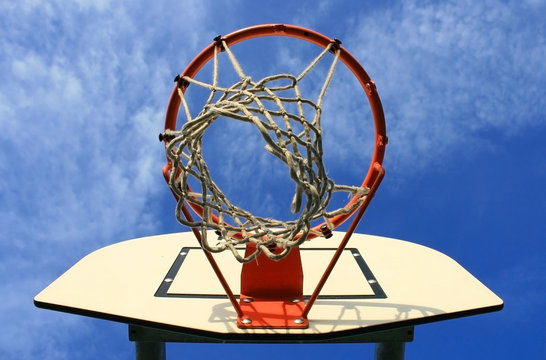 Photo of a basketball hoop on a sunny day
