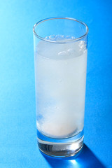 tablet dissolving in a glass of water