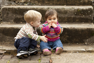 Young  Boy Giving Baby Girl a Hug
