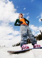 Young beautiful woman on the snowboard