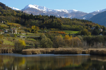 Autumn landscape with lake and mountains