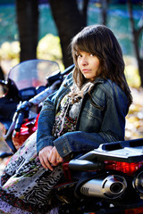 The girl the brunette about a motorcycle