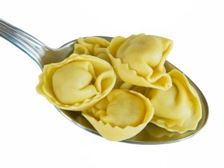 Fresh tortellini on spoon