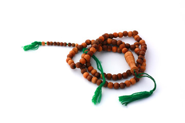 Wooden rosary isolated on white background