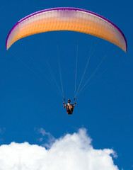 Paraglider above the cloud