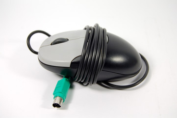 white-black computer mouse and green plug