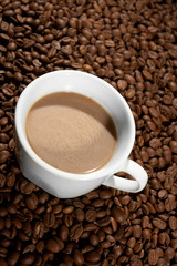 Cup with coffee, costing on coffee grain