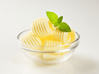 Butter curls in a glass bowl