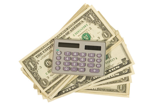 Calculator and a bunch of dollar bills (isolated on white)