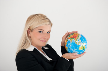 Young business woman with a planet globe