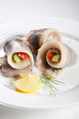 Marinated herring fillets with vegetables