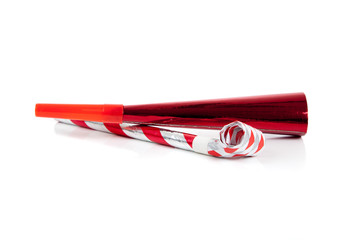 Red and silver noise makers on white