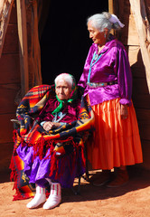 Very old Navajo woman with her daughter - obrazy, fototapety, plakaty