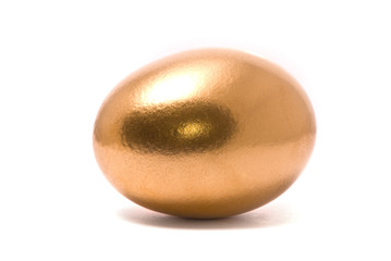 Golden egg on studio white background