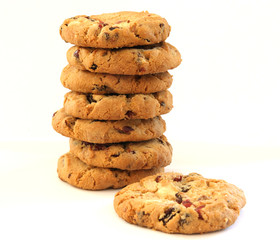 Stack of hazelnut cookies with chocolate and cranberies